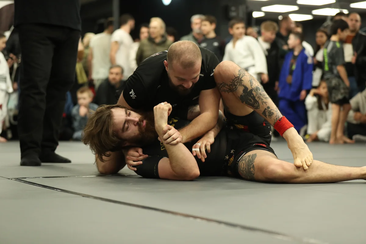 Adult BJJ competitors training at the camp facility