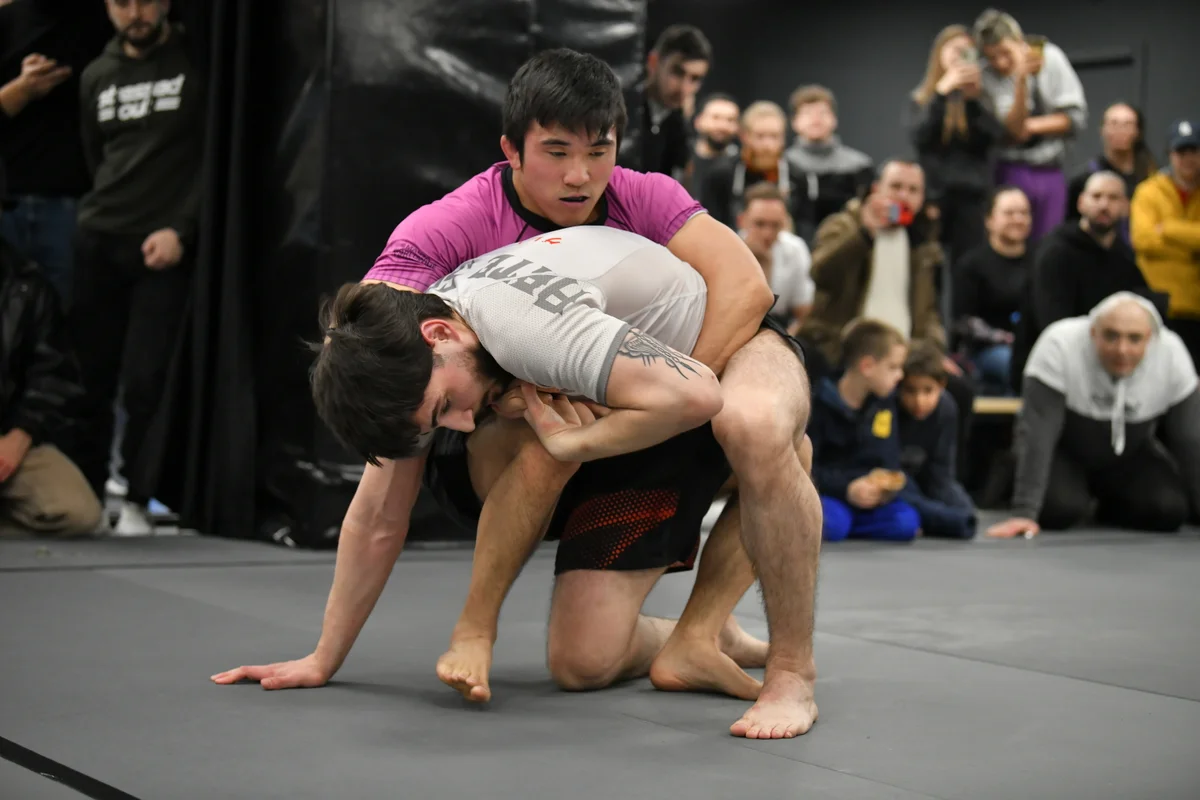 Adult grappling session with competition intensity